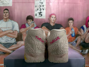 Rear view of the sneakers showing the embroidered “TWELVE” heel detail.