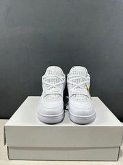 Front view of the white sneaker pair showing the lace arrangement, grid-style upper, rounded toe boxes, and textured forefoot soles.