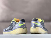 Rear view showing neon yellow Nike swooshes, black heel tabs, and Kobe branding details.