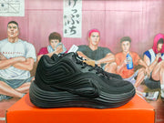 Side view of black Nike basketball shoes with a Swoosh and sculpted-looking outsole.