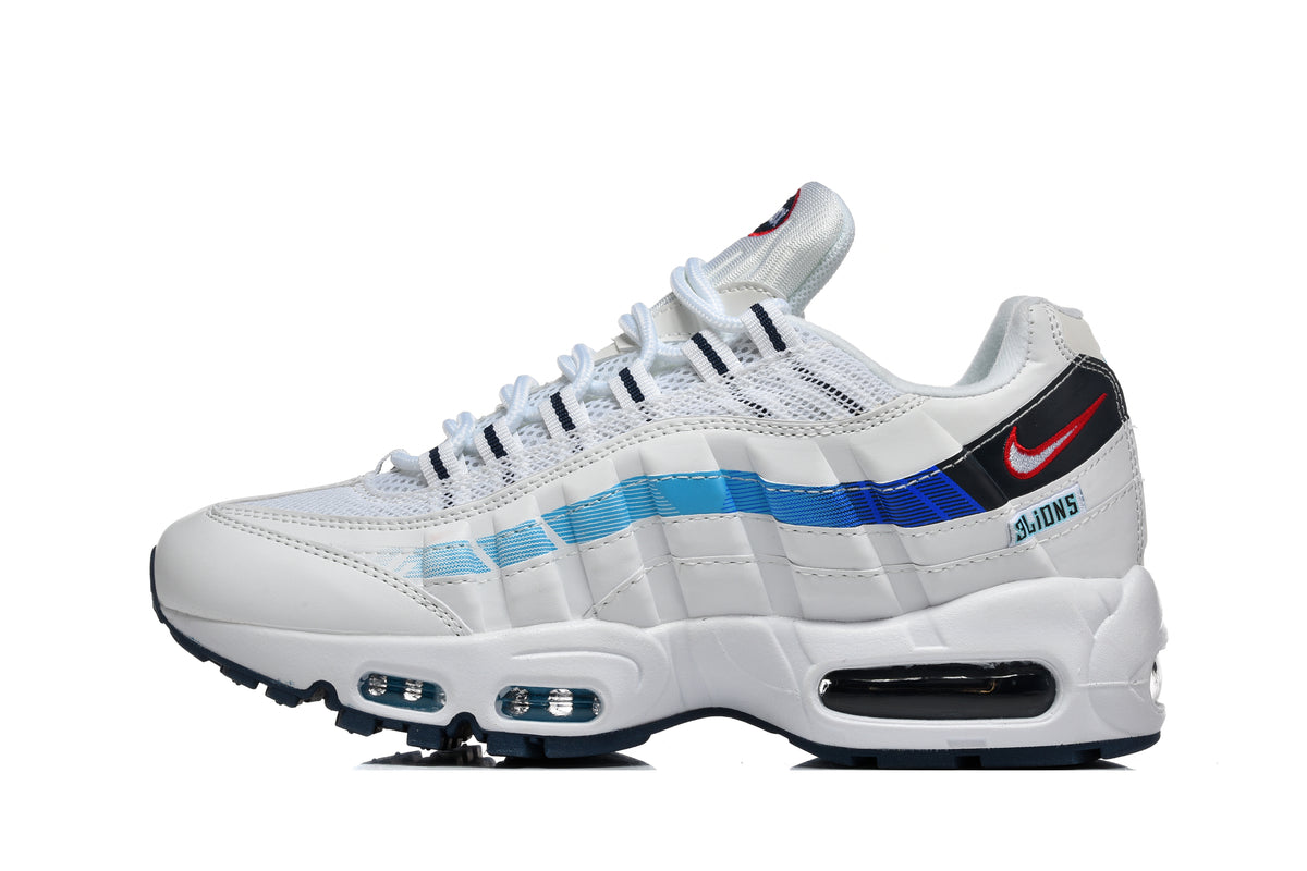 Side view of a white Nike sneaker with blue side accents, a red-accented Swoosh, and visible sole cushioning windows.
