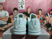 Rear view of pale blue Nike basketball shoes showing padded heels and light-colored midsoles.