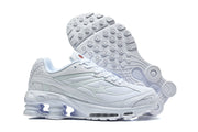 White Nike Shox Ride 2 sneaker shown beside an outsole view.