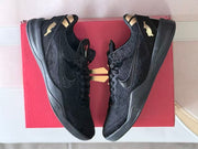 Pair of black Nike Kobe 8 shoes displayed over a red shoebox