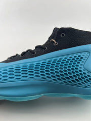 Close-up of the lace eyelets and honeycomb-patterned blue side panel