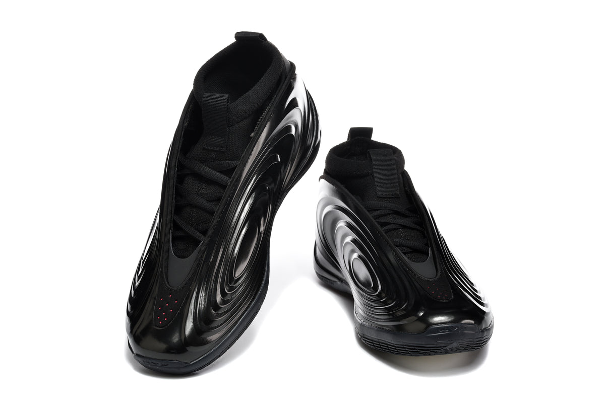Pair of black low-top sneakers shown from the front and side