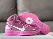 Side view beside the patterned pink outsole of a high-top basketball shoe.