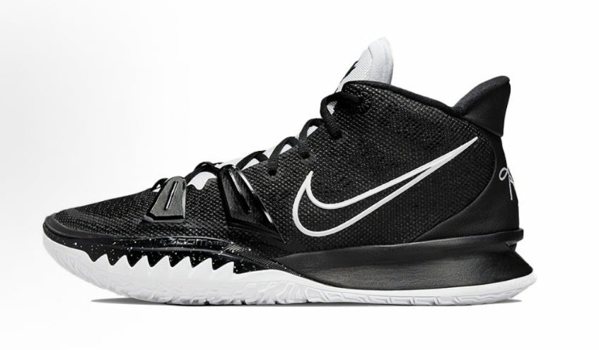 Side view of black and white Nike high-top basketball sneakers with a white Swoosh and textured outsole.