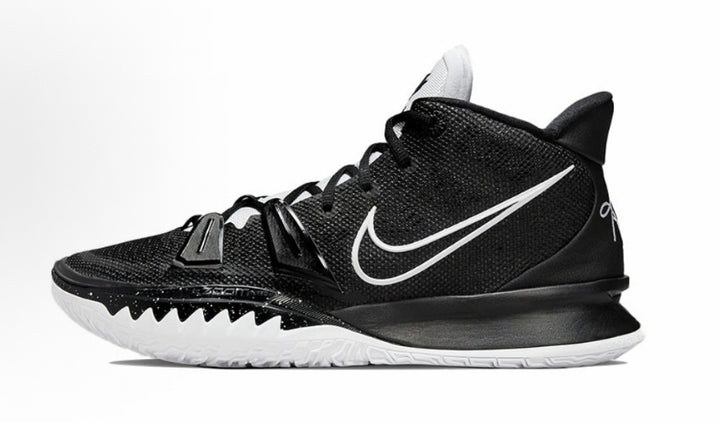 Side view of black and white Nike high-top basketball sneakers with a white Swoosh and textured outsole.