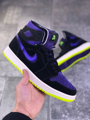 Front three-quarter view showing the purple perforated toe panel, black overlays and padded collar.