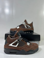 Brown and black Air Jordan 4-style sneakers shown in a close side view on a shoe box.