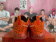 Rear view showing the leopard-print heel panels, orange pull tabs, black collars, and translucent outsole edges.