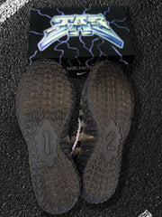 Pair of Nike sneaker outsoles showing the repeating traction pattern.