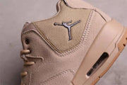 Close-up of the textured side panel, Jordan logo, stitching, and visible sole window.