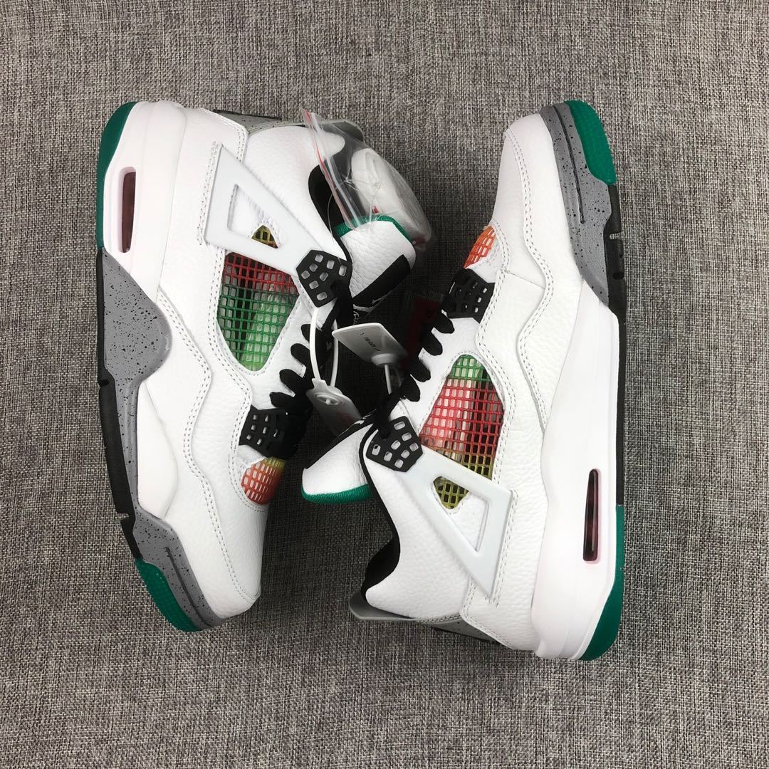 Pair of white Jordan Air Jordan 4 sneakers with green, black, grey, and multicolor accents shown from above.
