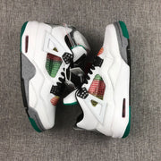 Pair of white Jordan Air Jordan 4 sneakers with green, black, grey, and multicolor accents shown from above.