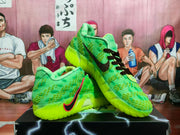 Angled view of bright green sneakers with black laces, a red-and-black side swoosh, textured panels, and a lime-green sole.