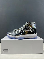 Side profile of a reflective silver and black high-top sneaker with blue outsole accents.