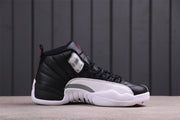 Opposite side view showing the black upper, white outsole, grey side detail, and red accents.