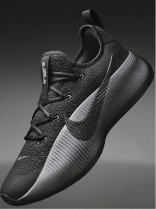 Black and gray Nike low-top basketball sneaker with a lace-up front and visible Swoosh
