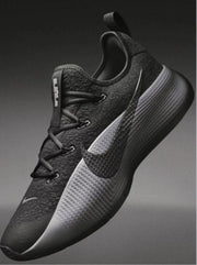 Black and gray Nike low-top basketball sneaker with a lace-up front and visible Swoosh