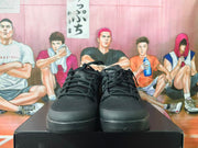Front view of black lace-up basketball shoes