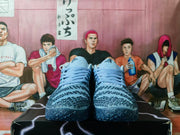 Front view of the blue and silver sneakers showing the toe pattern, matching laces and dark outsole.