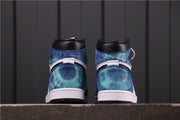 Rear view of the pair showing blue tie-dye heel panels, black collars, and white midsoles.