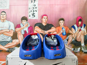Rear view of blue slides with red footbed details.