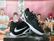 Pair of black Nike basketball sneakers shown from the side and at an angle.