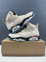 Angled product view showing both sneakers, perforated side panels, black laces, and translucent cushioning elements.