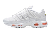 Side profile of a white Nike Air Max Plus sneaker with mesh panels and orange Air units.