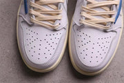 Close-up of the perforated white toe boxes and cream-colored laces.