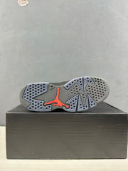 Outsole view showing the gray traction pattern and red Jordan branding.