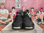 Front view of black Jordan basketball sneakers with lace-up closure and Jumpman tongue logos.