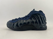 Dark navy and black high-top sneaker with a glossy black side panel.