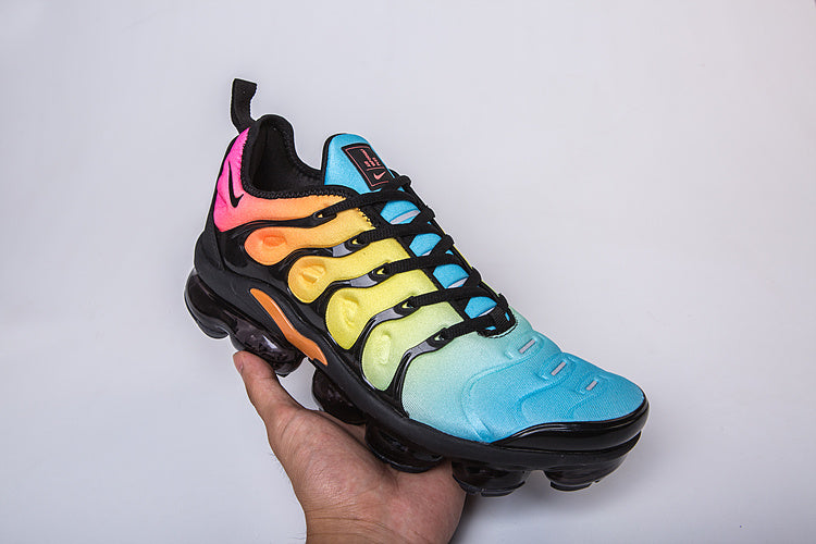 Nike Air VaporMax Plus sneaker showing the multicolor gradient upper and black sole