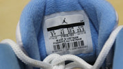 Inner label showing US 5Y, UK 4.5, EU 37.5, CM 23.5, and style code 510815-127.