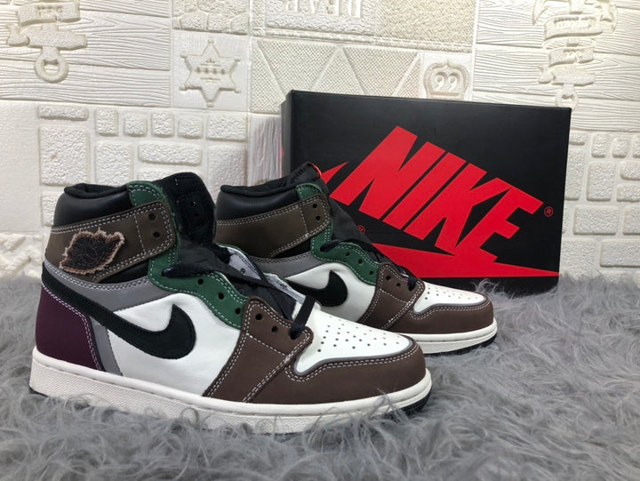 Pair of multicolor Jordan high-top sneakers displayed in front of a Nike shoebox.