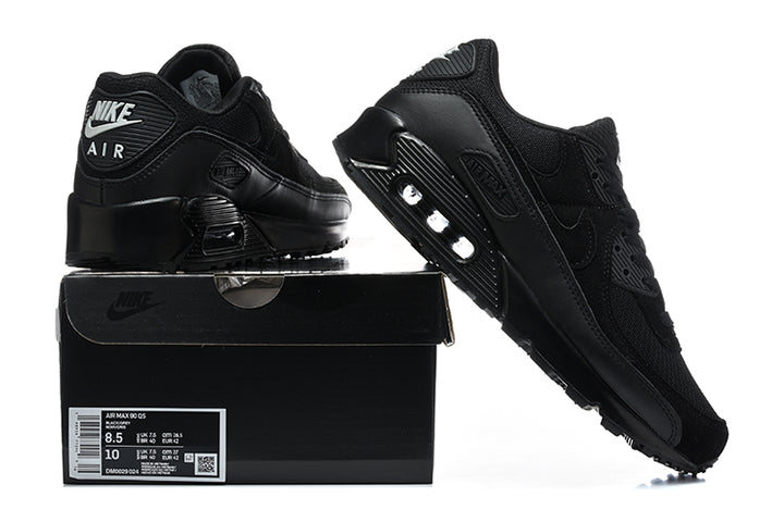 Black Nike Air Max 90 QS sneakers displayed with a black shoe box; the box label shows a sample size.