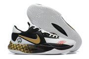 Black and white basketball shoe with gold dragon-inspired graphics and a white patterned outsole.