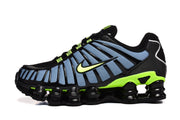 Side view of black, blue, and volt Nike Shox TL sneakers.