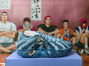 Side view of a glacier-blue Nike Ja 2 shoe showing its patterned upper, Ja heel charm, and blue outsole.
