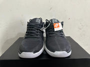 Front view of black lace-up basketball shoes with white midsoles