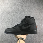 Side view of the black sneaker showing the tonal Swoosh and high-top collar.