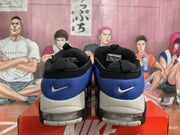 Rear view of the blue Nike sneakers with heel branding and visible cushioning