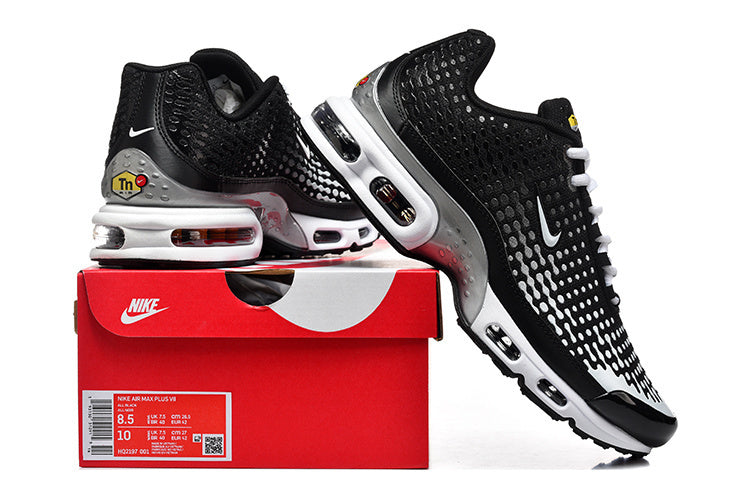 Black and white Nike Air Max Plus VII shoes displayed with a red Nike box; box label shows sample sizes 8.5 and 10.