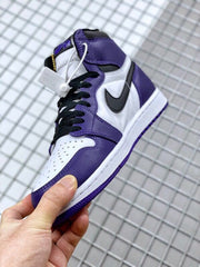 Angled close-up showing the purple and white upper, black laces, and black Swoosh.