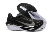 Side and outsole views of black Nike Zoom Fly 6 shoes with black, gray, and white details.