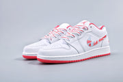 Three-quarter view of the pair with white uppers, pink-red accents, and red outsoles.